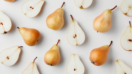 Whole pears, some halved, and others sliced, arranged in a minimalist style. The details of the pear's texture and seeds are highlighted on a white backdrop