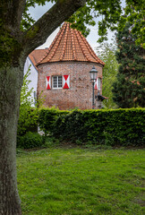 tall sharp spire of a tower building in a small town in europe
