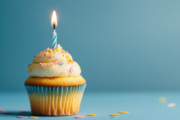 Delicious Cupcake with Single Candle Against Blue Background, Perfect for Celebrations and Birthdays