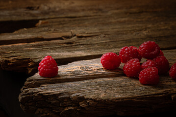 raspberries on wooden background