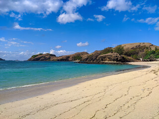 Kuta Lombok has beautiful beaches and surf spots, Kuta Mandalika Beach Lombok, beach with blue sky and clouds, beach in the summer, beach with trees