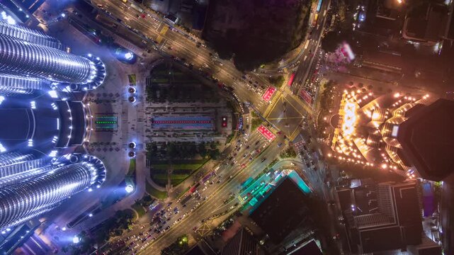 Aerial timelapse of evening traffic at an intersection in downtown Kuala Lumpur, Malaysia