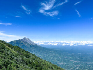 View from the top of Mountain Merbabu via Suwanting.  with a view of Mount Merapi