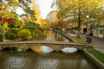 River Windrush, bridge and buildings in Bourbon-on-the Water, UK