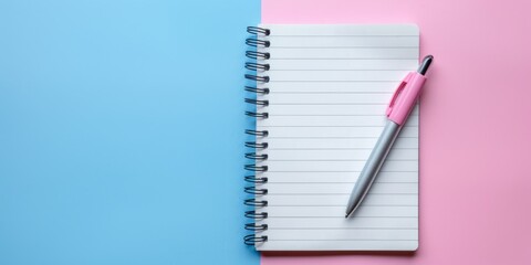 a notebook with a pen, pastel colors, copy space
