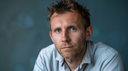 Fototapeta premium Portrait of a positive European male on a solid background