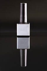 gray gel polish on a black background