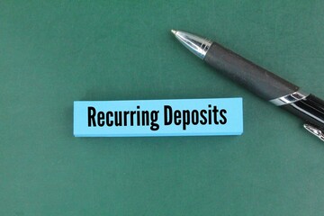 colored pen and paper with the words Recurring Deposits