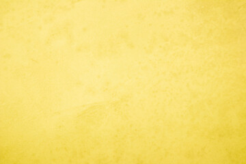 Yellow concrete stone texture for background in summer wallpaper. Cement and sand wall of tone vintage minimal. Concrete abstract wall of light yellow color, cement texture white blank for home decor.