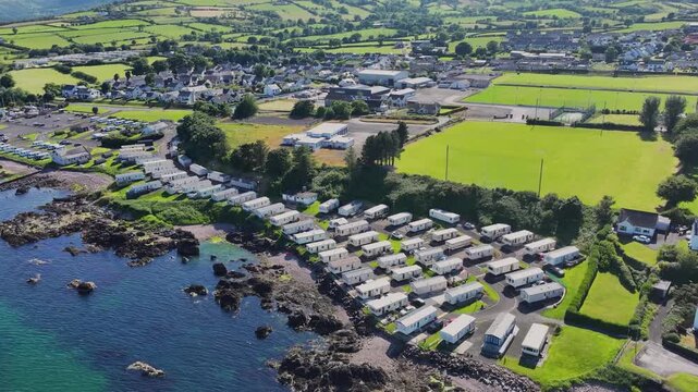 Aerial View of Cushendall Caravan Park and Lurig Caravan Club on the Irish Sea Cushendall Co Antrim Northern Ireland on a sunny day 27-07-24 