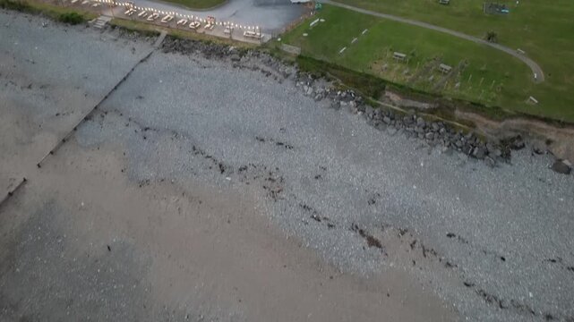 Aerial video over the coastline at Criccieth Beach Criccieth UK