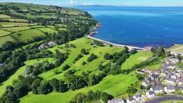 Aerial View of Cushendall Golf Club Course on the Irish Sea Co Antrim Northern Ireland on a sunny day with a blue sky 27-07-24