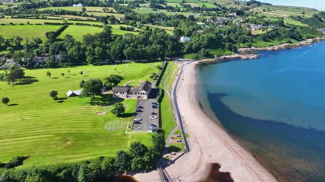 Aerial View of Cushendall Golf Club Course on the Irish Sea Co Antrim Northern Ireland on a sunny day with a blue sky 27-07-24