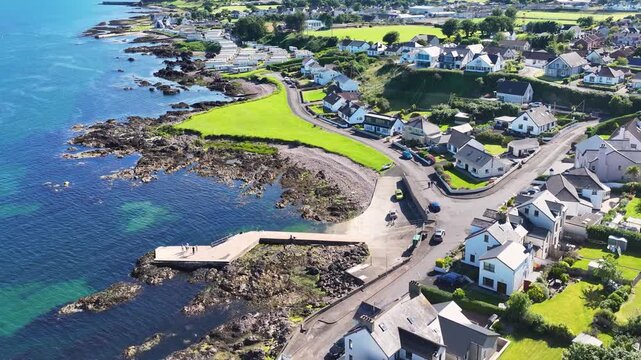 Aerial View of Cushendall Harbour on the Irish Sea Co Antrim Northern Ireland on a sunny day with a blue sky 