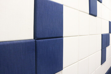 Blue and white fabric acoustic wall background.