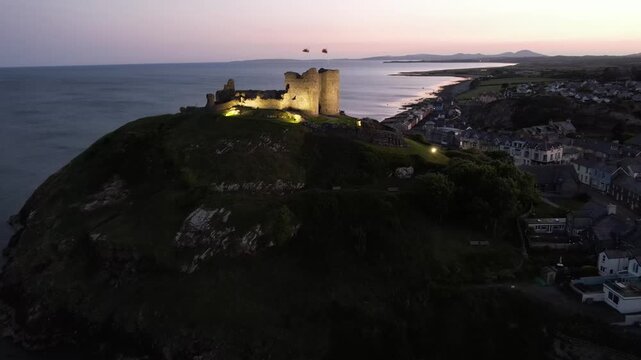 Aerial video over Castell Cricieth near Criccieth Beach Criccieth UK