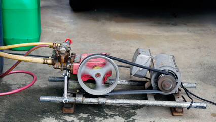 The electric motor is rotating to make the pump work.