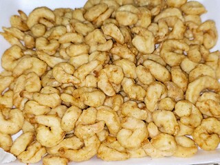 Fried shrimps covered with flour and fried in deep hot oil, shrimps are crustacean (a form of shellfish) with an elongated body and a primarily swimming mode of locomotion, Caridea or Dendrobranchiata
