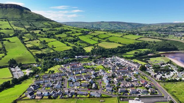Aerial View of Residential homes and Town houses in Waterfoot Village and Lurig mountain Glenariff Co Antrim Northern Ireland