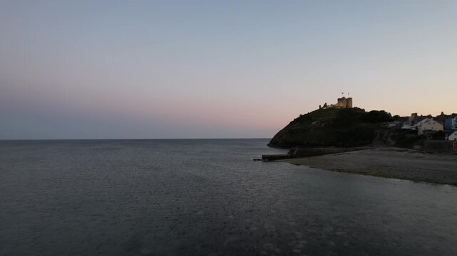 Aerial video over Castell Cricieth near Criccieth Beach Criccieth UK