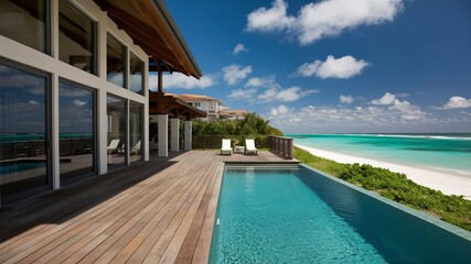 Fototapeta premium A luxurious beachfront vacation home with large glass windows, a wooden deck, and an infinity pool overlooking the turquoise ocean and a white sandy beach., photo, cinematic, architecture