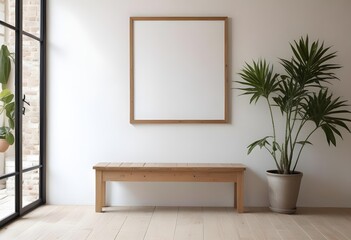 Fototapeta premium A wooden frame on a white wall with a wooden bench and a potted plant in the foreground