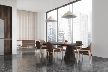 Modern home kitchen interior with eating table and chairs, drawer and window