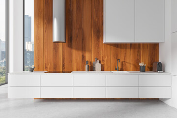 White modern home kitchen interior with cooking cabinet and panoramic window
