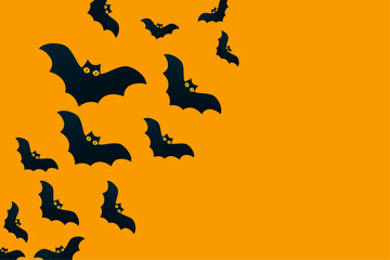 Bats on an orange background. Halloween holiday concept. Black silhouettes. Empty space for text. Copy space. Greeting card, party invitation.