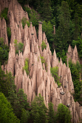 Unique Natural Rock Formations Surrounded by Lush Green Forest in Early Summer