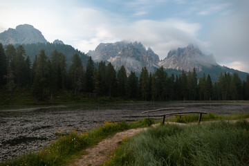Enchanting Landscape at Sunrise With Mountains, Water Body, and Lush Greenery in a Serene Natural Setting