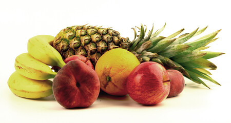 Assorted fresh fruits displayed artistically on a light background with pineapple, bananas, apples, and orange