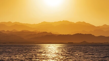Naklejka premium Golden sunset over the Red sea sun hiding behind the mountain epic view from sharm el sheikh egypt : Generative AI
