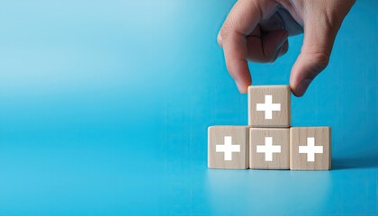 Fototapeta premium Value add concept. Hand place wooden cube with plus sign on light blue background. Positive thinking or personal growth and development. download style which means value added. value add for business.