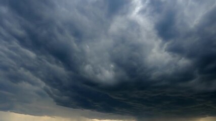 A dramatic scene of dark, ominous clouds indicating an impending storm, showcasing nature's dynamic weather changes
