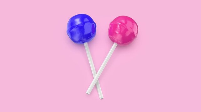 Blue and pink lollipops on a pink background