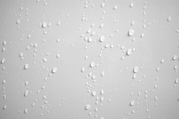 Water drops on white wall background texture