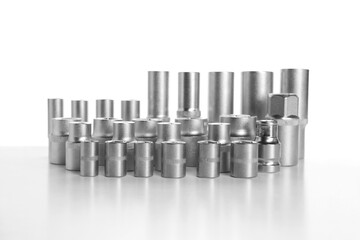 Set of different sockets on white background. Auto mechanic's tools