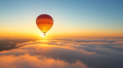 Obraz premium Hot air balloon above the clouds at sunrise or sunset.