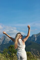 A young beautiful woman is enjoying her vacation in the Great Tatra Mountains