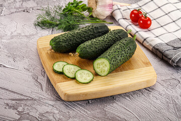 Raw green cucumbers with slices