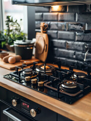 Obraz premium A black stove top with a digital display and a wooden countertop