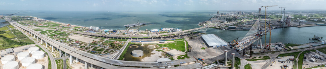 panoramic aerial landscape view around Corpus Christi Bay and Nueces Bay with Nueces Bay Causeway, U.S.181 Highway, Texas State Aquarium, USS Lexington and Corpus Christi Skyline in Background © Mario Hagen