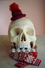  Human skull with pills in mouth. 
