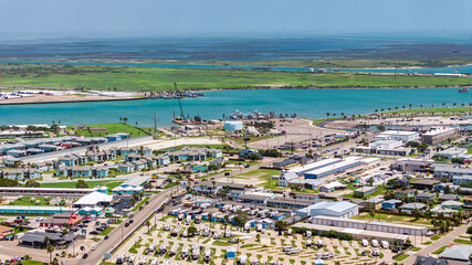 Port Aransas, USA, aerial city view of Port Aransas Ferry Landing area located on Mustang Island at Gulf of Mexico with infrastructure for ferry landing