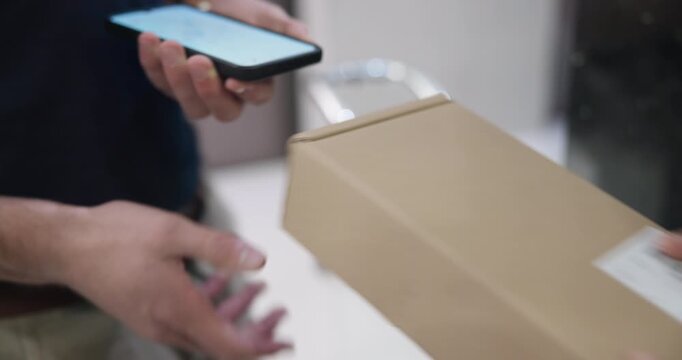 Hands, phone and box for delivery, signature and ecommerce with package and courier man by office. People, mobile and cardboard by door for logistics, distribution and online shopping with shipping