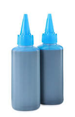 Bottles of light blue printer ink isolated on white