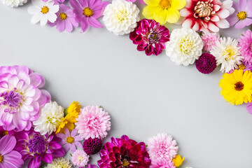 Creative layout made of flowers asters, dahlias, calendula. Floral Greeting card. Colorful autumn flower background with space for text. Nature trendy decorative design. Nature concept. Flat lay.