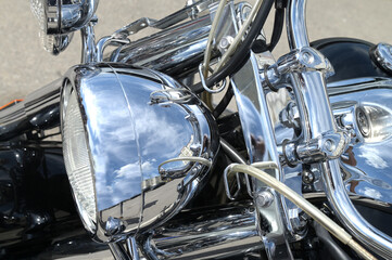 Fototapeta premium Motorcycle chrome elements. Shiny chrome motorcycle headlight.