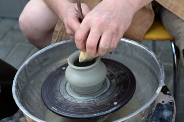 Making of mud pot on potters wheel during the master class.